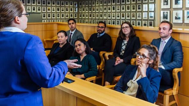 Student presents to a jury in moot court.