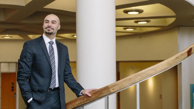 Student standing on staircase